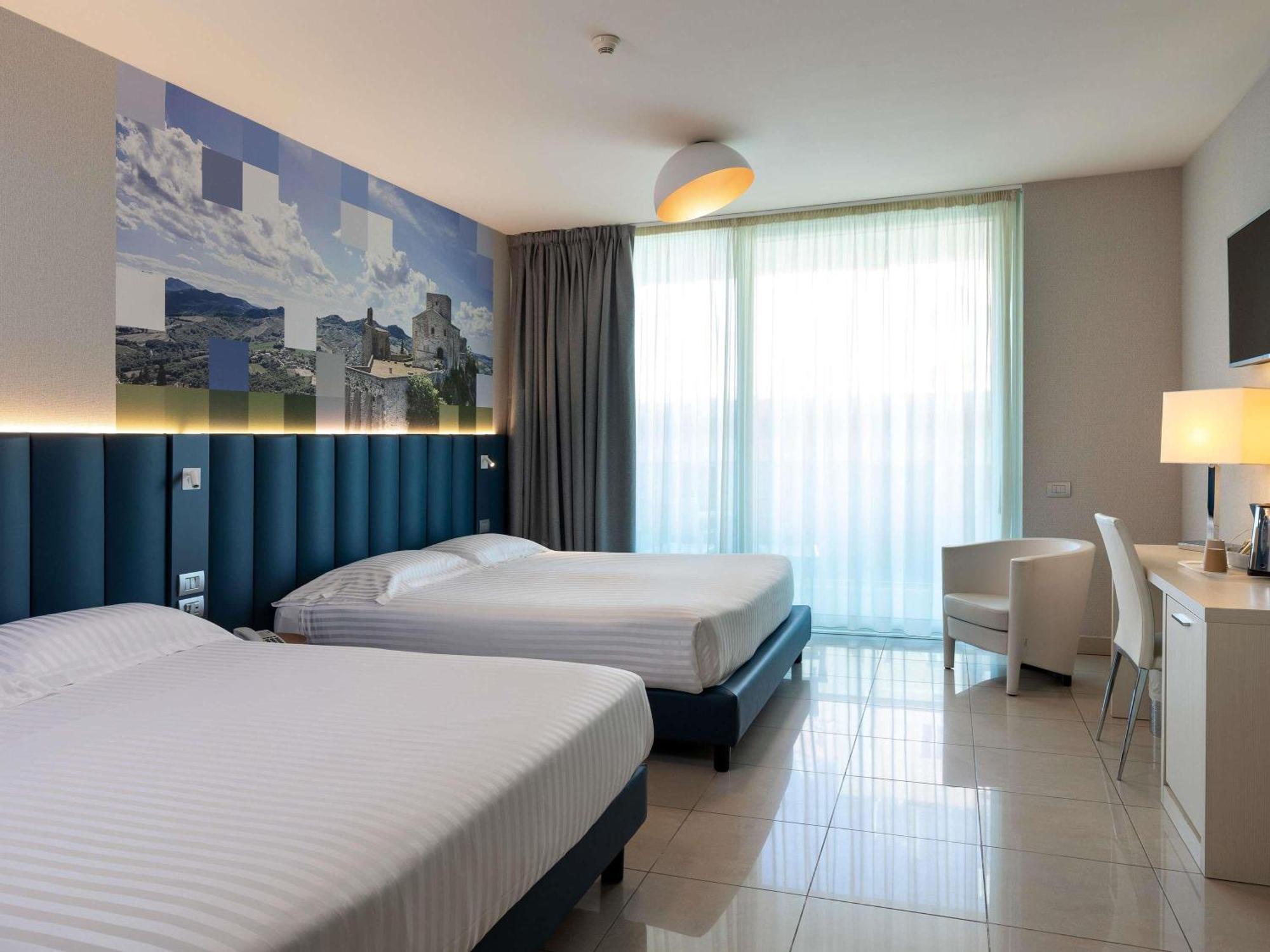 Superior Double Room with Sofa Bed and Balcony with Side Sea View