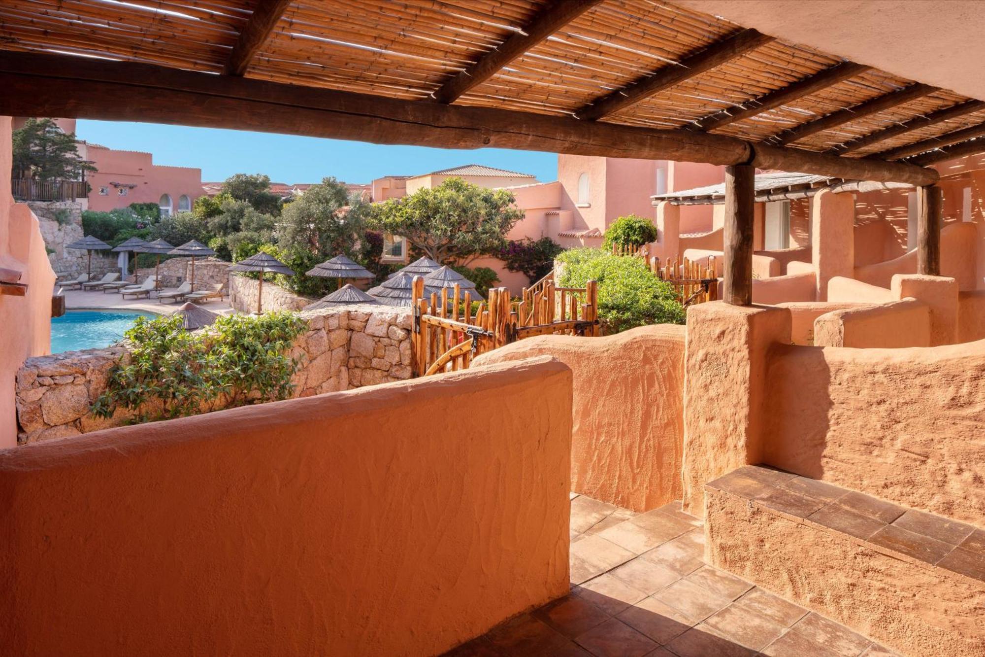 Two-bedroom Deluxe Suite King size bed pool or canal view terrace