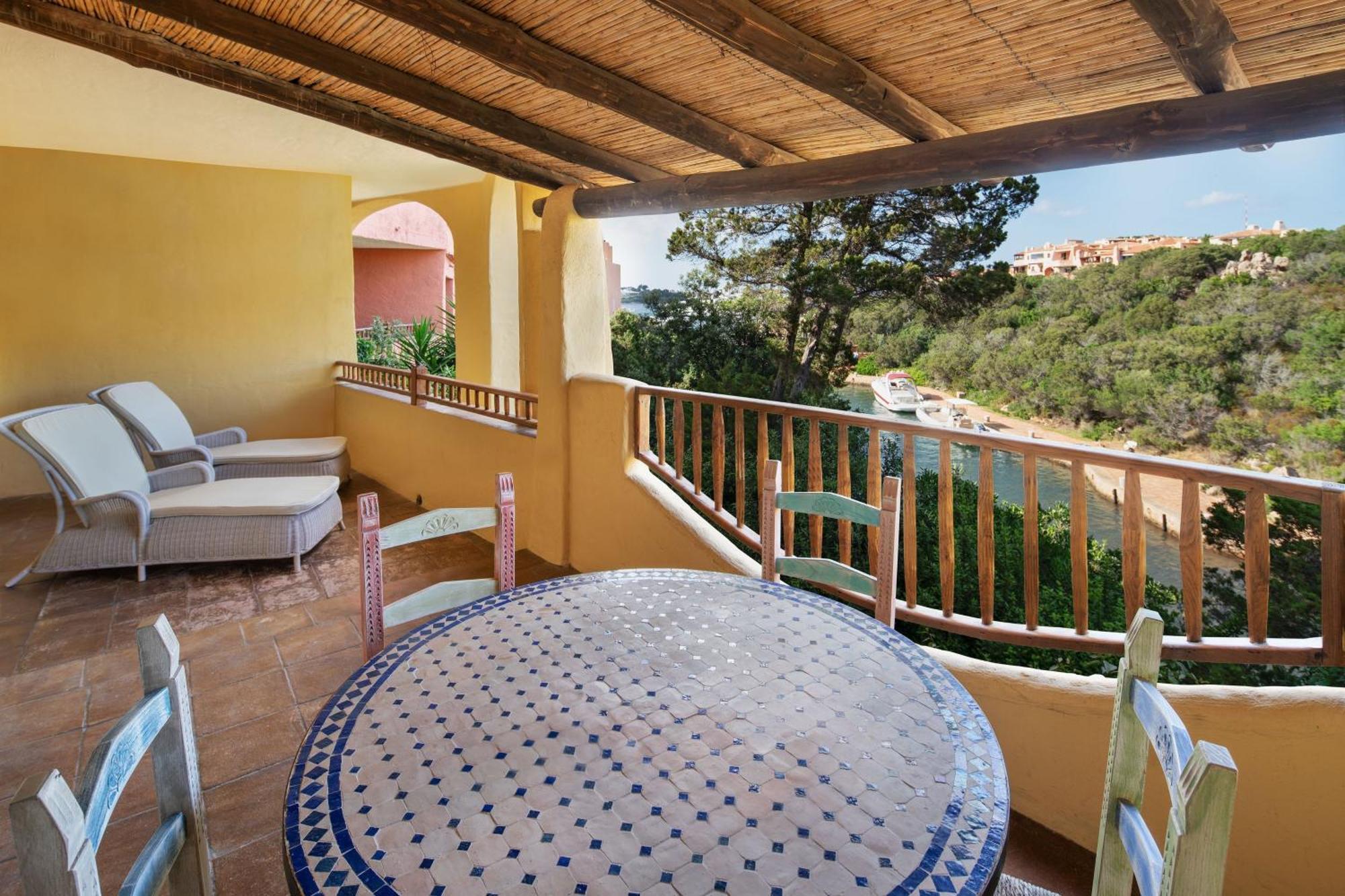 Two-bedroom Deluxe Suite King size bed pool or canal view terrace