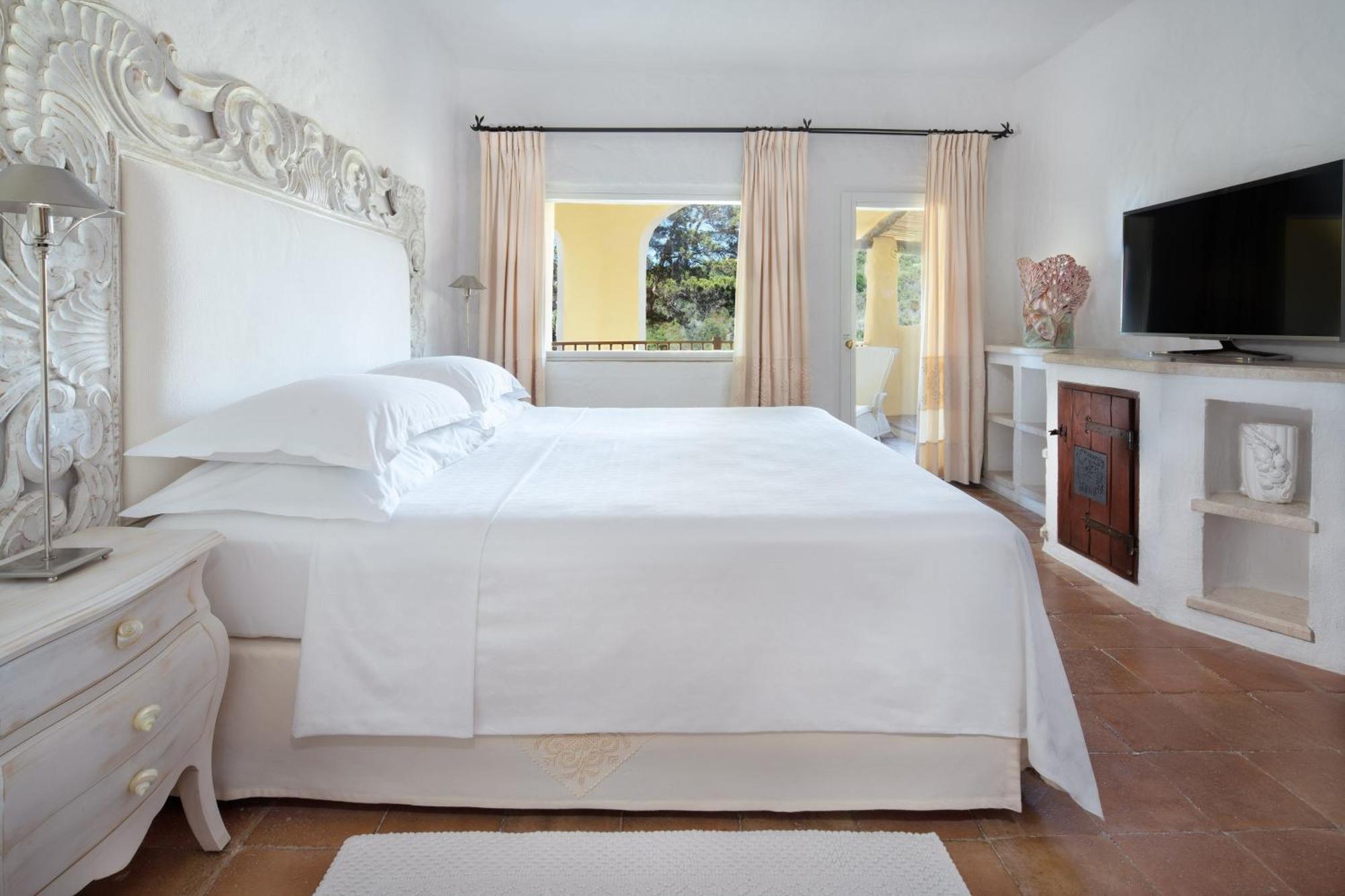 Two-bedroom Deluxe Suite King size bed pool or canal view terrace