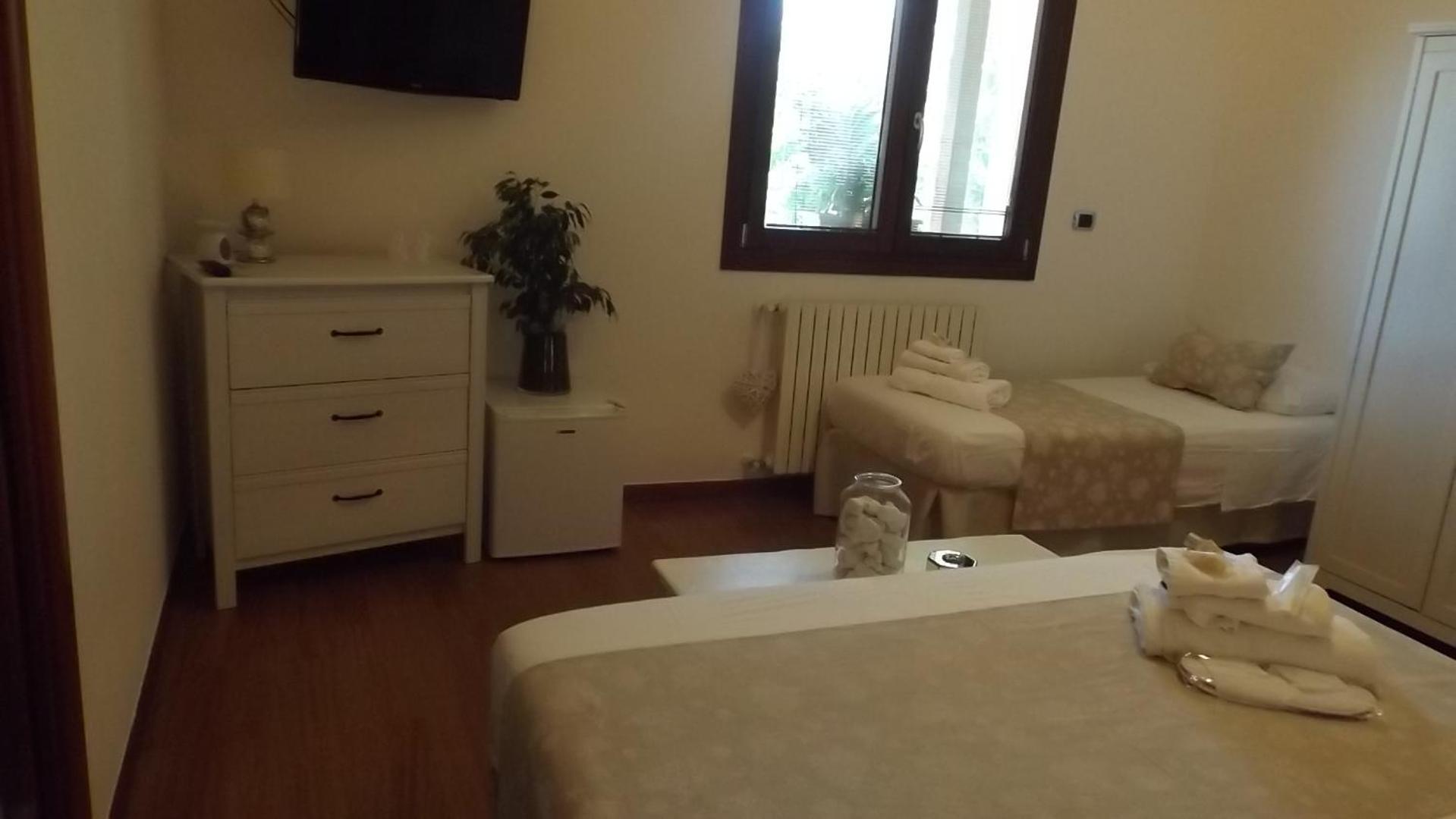 Camera Tripla con Vista Giardino